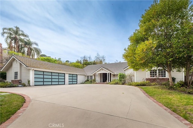 view of front of property with brick siding and driveway