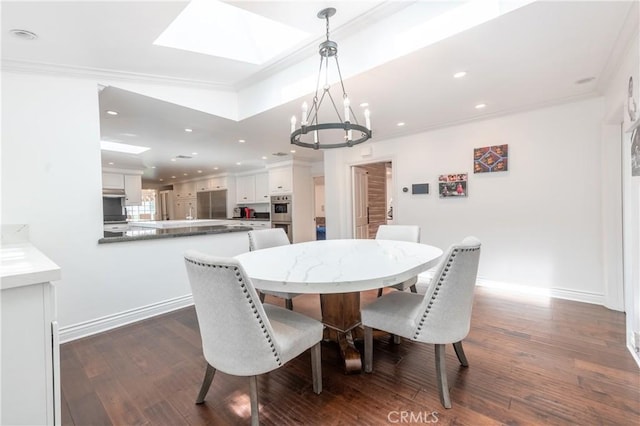 dining space with baseboards, dark wood-style flooring, and crown molding