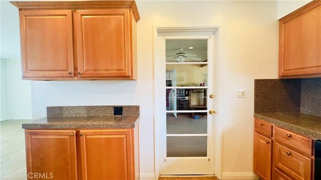 28821 Del Monte Dr, Menifee, CA 92586 - kitchen with ceiling fan and tile counters