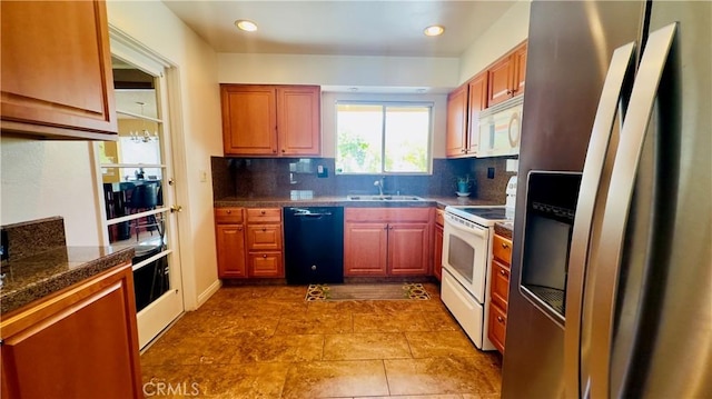 28821 Del Monte Dr, Menifee, CA 92586 - kitchen with white appliances, dark countertops, backsplash, recessed lighting, and dark tile patterned floors