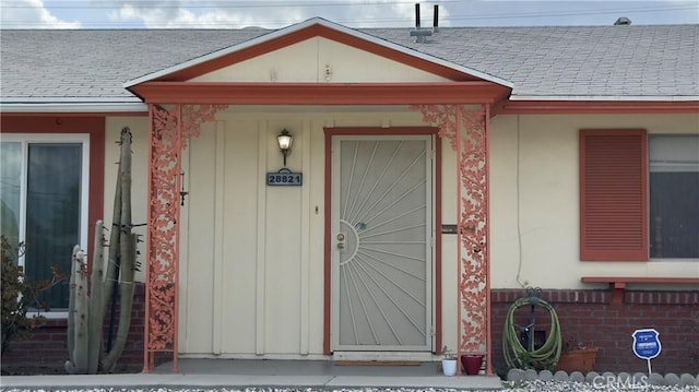 28821 Del Monte Dr, Menifee, CA 92586 - property entrance featuring a shingled roof