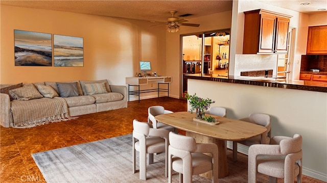 28821 Del Monte Dr, Menifee, CA 92586 - dining space featuring ceiling fan and dark tile patterned floors