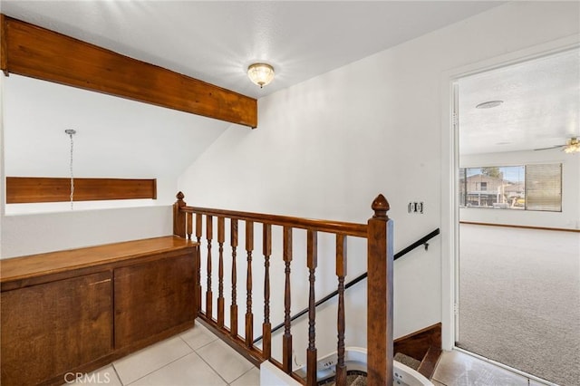 13615 Spring Valley Pkwy, Victorville, CA 92395 - stairs featuring carpet floors, a ceiling fan, vaulted ceiling with beams, and tile patterned floors
