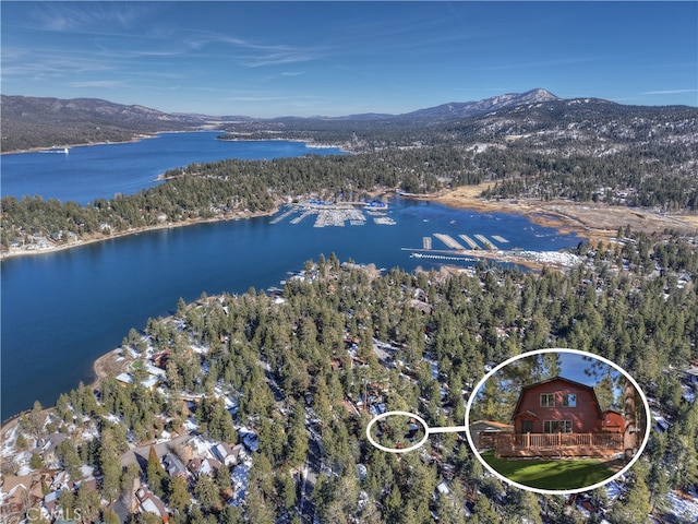 aerial view featuring a water and mountain view