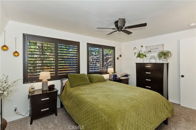 bedroom with a ceiling fan and carpet flooring