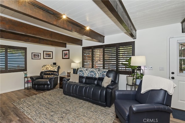 living room with beamed ceiling and wood finished floors