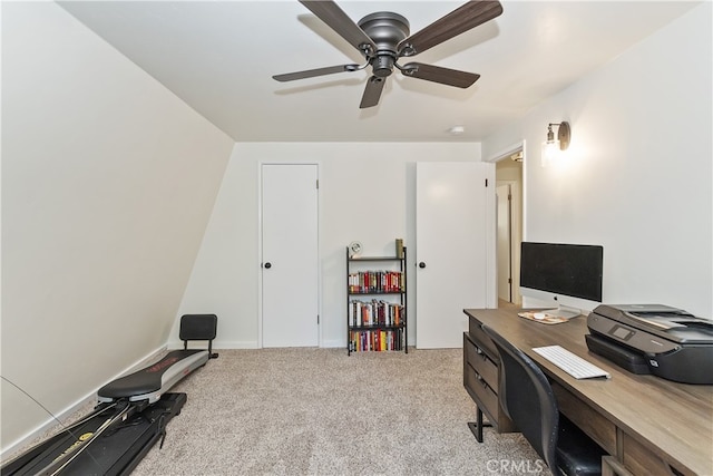 carpeted office featuring ceiling fan