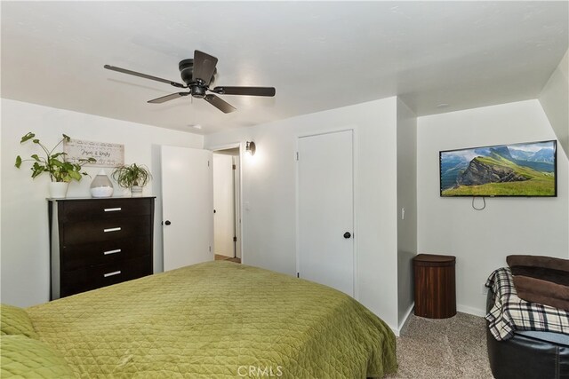 bedroom featuring ceiling fan, carpet flooring, and baseboards