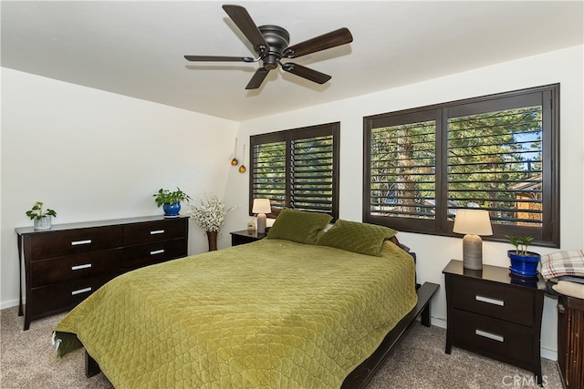 bedroom with carpet, multiple windows, and ceiling fan