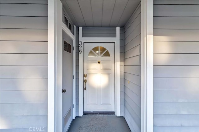 entrance to property featuring visible vents