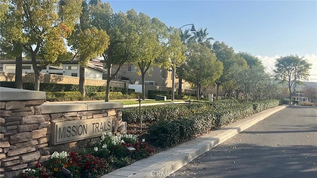 view of home's community with fence