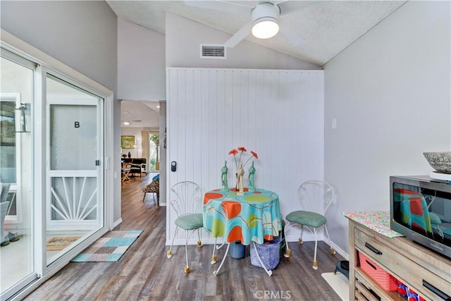 rec room featuring vaulted ceiling, ceiling fan, wood finished floors, and visible vents