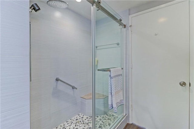 full bathroom featuring a shower stall