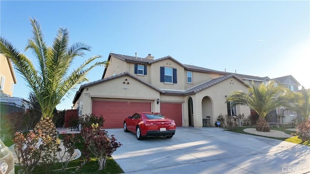 view of front of property featuring a chimney, stucco siding, concrete driveway, and fence