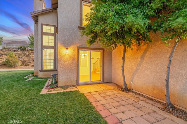 41445 Terrazzo Dr, Palmdale, CA 93551 - entrance to property with stucco siding, a yard, and a patio area