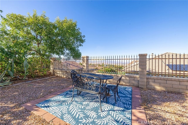 view of patio / terrace featuring fence