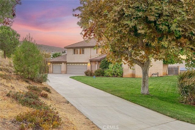41445 Terrazzo Dr, Palmdale, CA 93551 - view of front of house with stucco siding, concrete driveway, a garage, and a tile roof