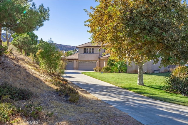 view of property hidden behind natural elements with concrete driveway, a front lawn, and stucco siding