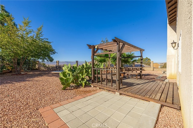 view of patio featuring fence, a deck, and a pergola