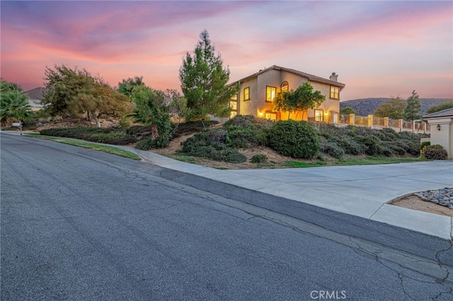 41445 Terrazzo Dr, Palmdale, CA 93551 - view of front of home with a chimney and stucco siding