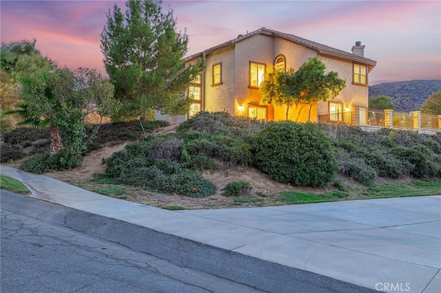 41445 Terrazzo Dr, Palmdale, CA 93551 - view of side of home with a chimney and stucco siding