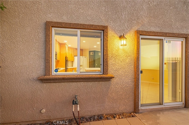 exterior space featuring stucco siding