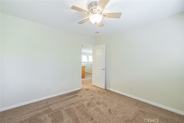 41445 Terrazzo Dr, Palmdale, CA 93551 - empty room with light colored carpet, baseboards, and a ceiling fan