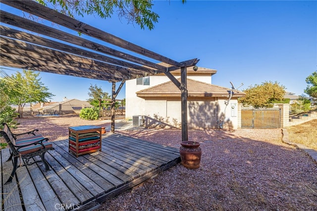 view of patio / terrace with central AC unit, a gate, fence, a wooden deck, and a pergola