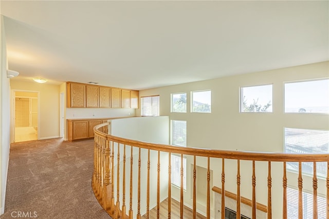 41445 Terrazzo Dr, Palmdale, CA 93551 - hallway with an upstairs landing, carpet flooring, and baseboards