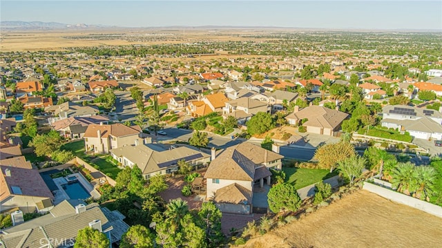 drone / aerial view with a residential view and a mountain view