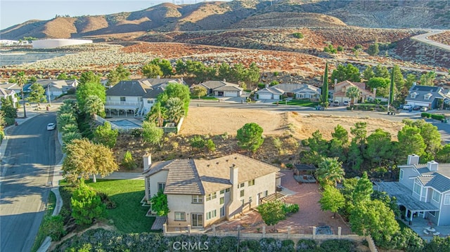 birds eye view of property with a residential view and a mountain view