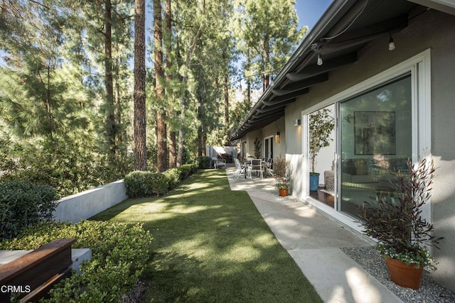 view of yard featuring a patio area and fence