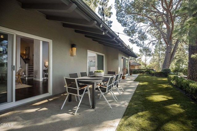 view of patio featuring outdoor dining area