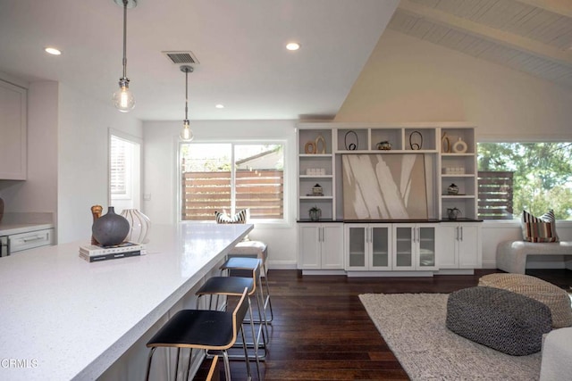 living room with lofted ceiling with beams, visible vents, dark wood-style flooring, and recessed lighting