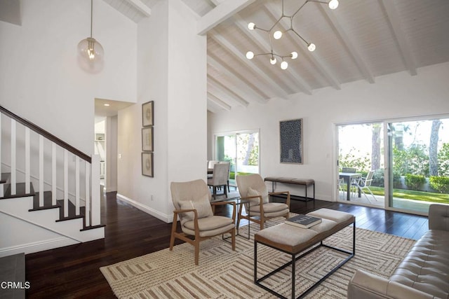 living area featuring high vaulted ceiling, hardwood / wood-style floors, beam ceiling, and baseboards