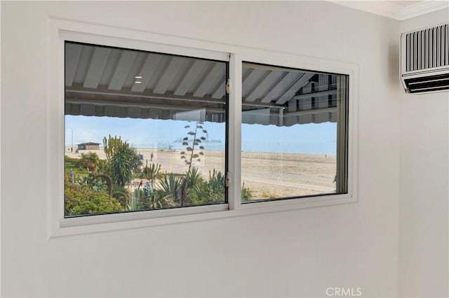 interior space featuring a wall unit AC and ornamental molding