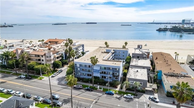 birds eye view of property featuring a water view and a view of the beach