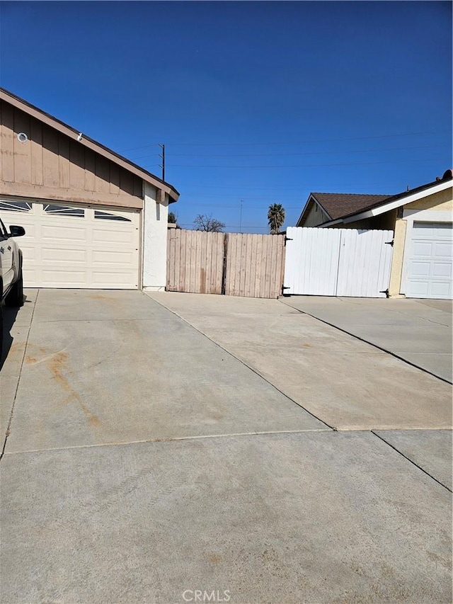 exterior space with a garage and fence