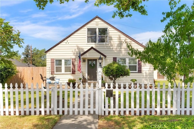 bungalow with a fenced front yard