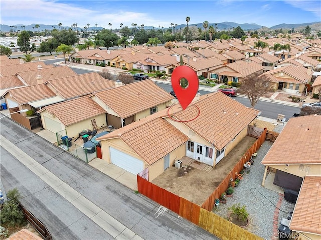 bird's eye view featuring a residential view and a mountain view