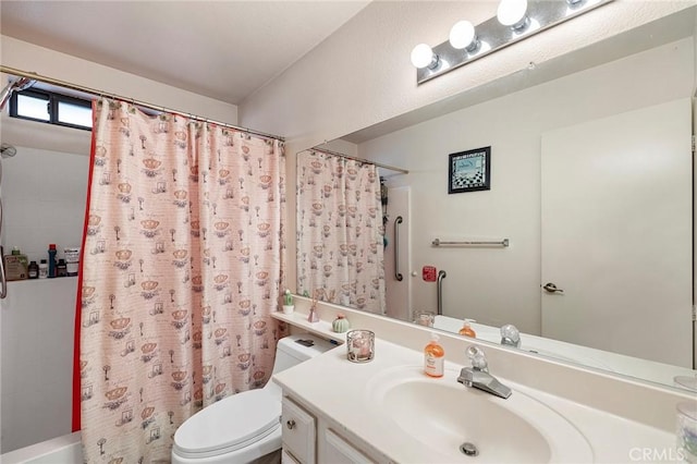 bathroom with shower / bath combination with curtain, vanity, and toilet