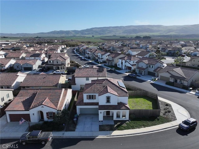 drone / aerial view with a mountain view and a residential view