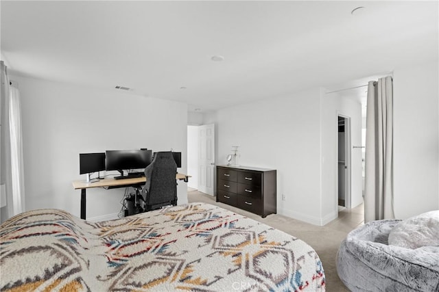 bedroom featuring baseboards, visible vents, and light colored carpet