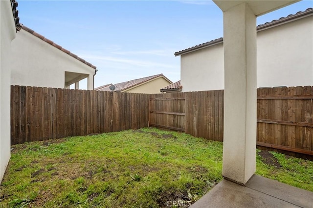 view of yard with a fenced backyard