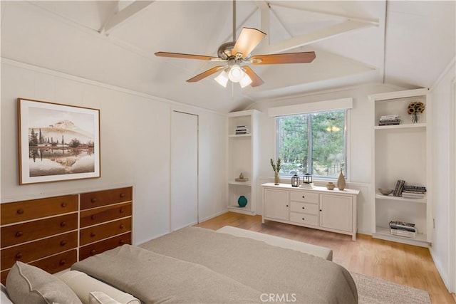 bedroom with lofted ceiling, light wood finished floors, and a ceiling fan