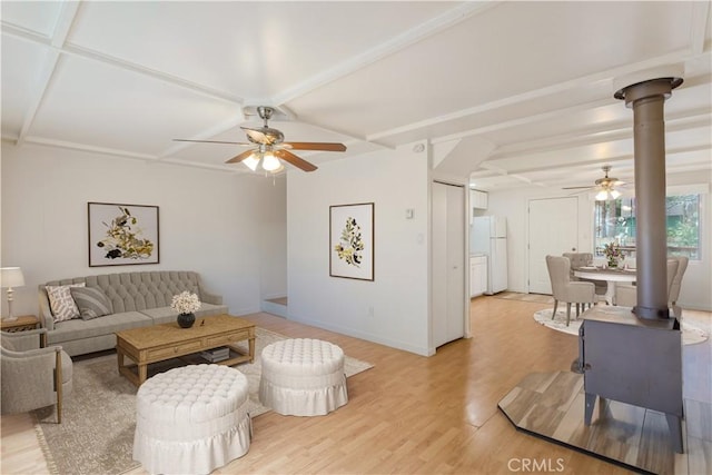 living area featuring light wood finished floors, coffered ceiling, a ceiling fan, and baseboards