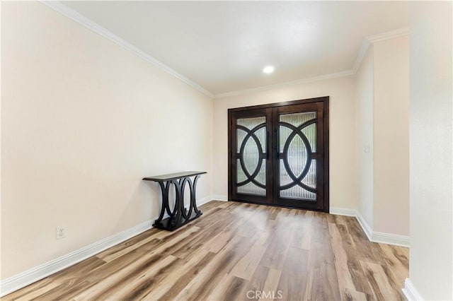 entryway with baseboards, french doors, and wood finished floors