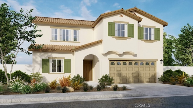 mediterranean / spanish-style house featuring concrete driveway, a tiled roof, and stucco siding