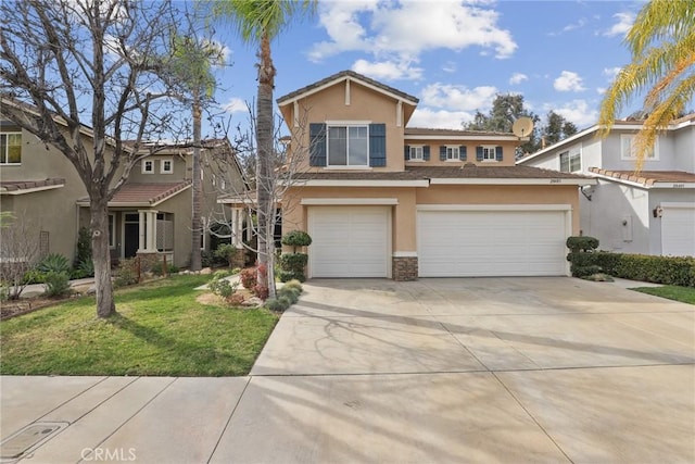 view of front of property featuring concrete driveway, a front lawn, and stucco siding