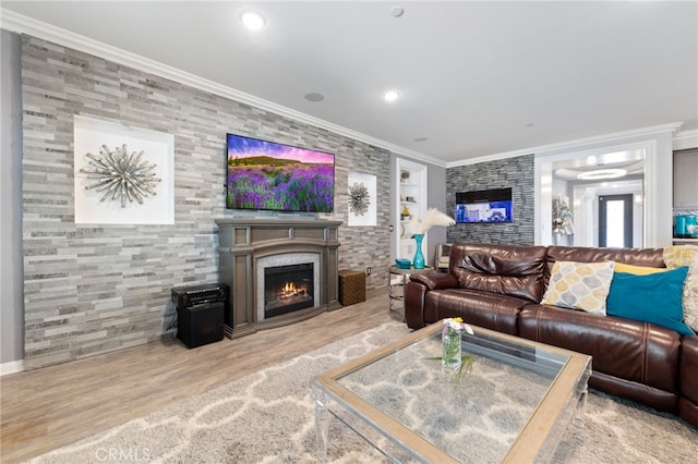 20900 Center St, Riverside, CA 92507 - living area featuring a glass covered fireplace, wood finished floors, built in shelves, recessed lighting, and ornamental molding
